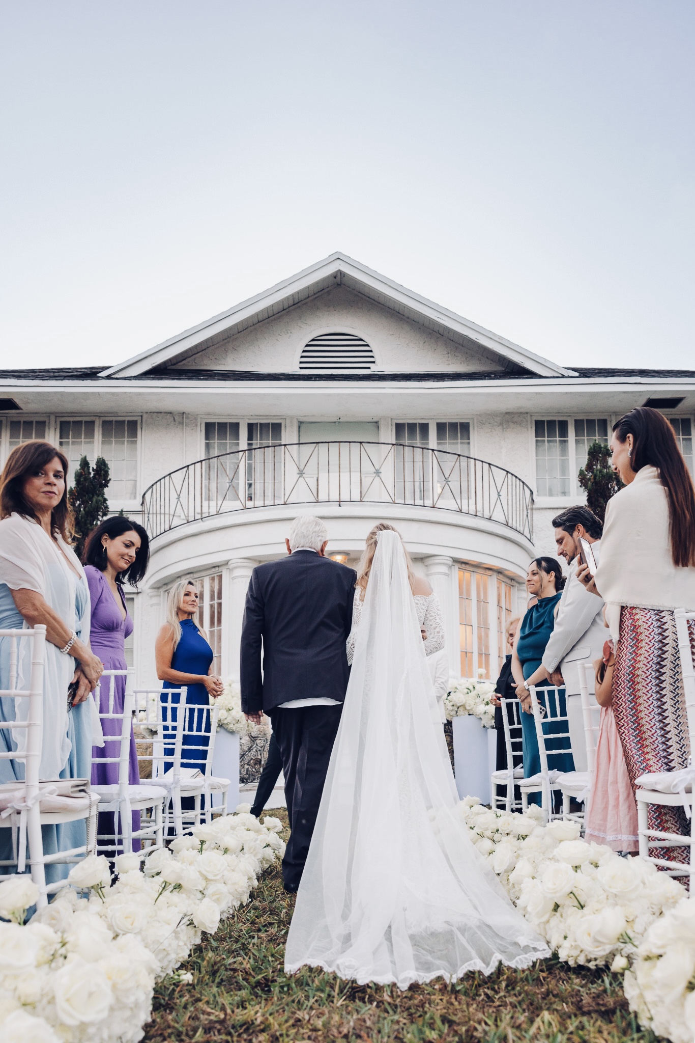 Bride walking down the ceremony aisle