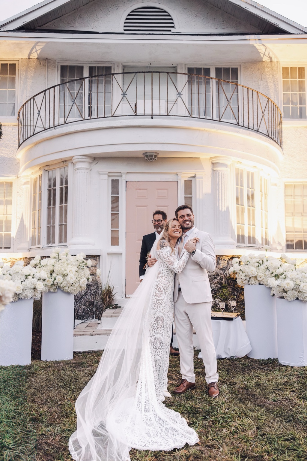 Newlyweds smiling after their garden ceremony