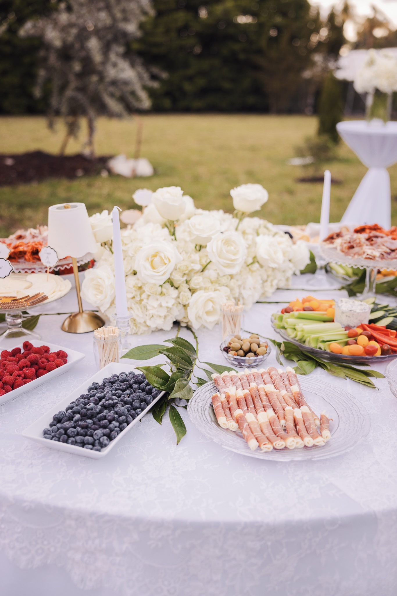 Wedding grazing table with white flowers